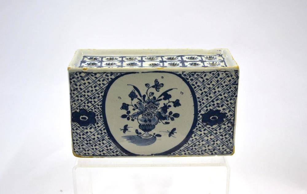 Lot 30 - An English Delft Flower Brick, probably London, circa 1740, of rectangular form, the top with three
