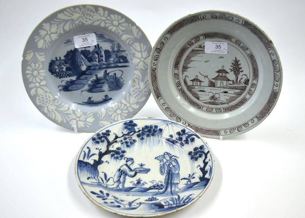 Lot 35 - A Bristol Delft Plate, circa 1760, painted in blue with fishermen, buildings beyond, within a...