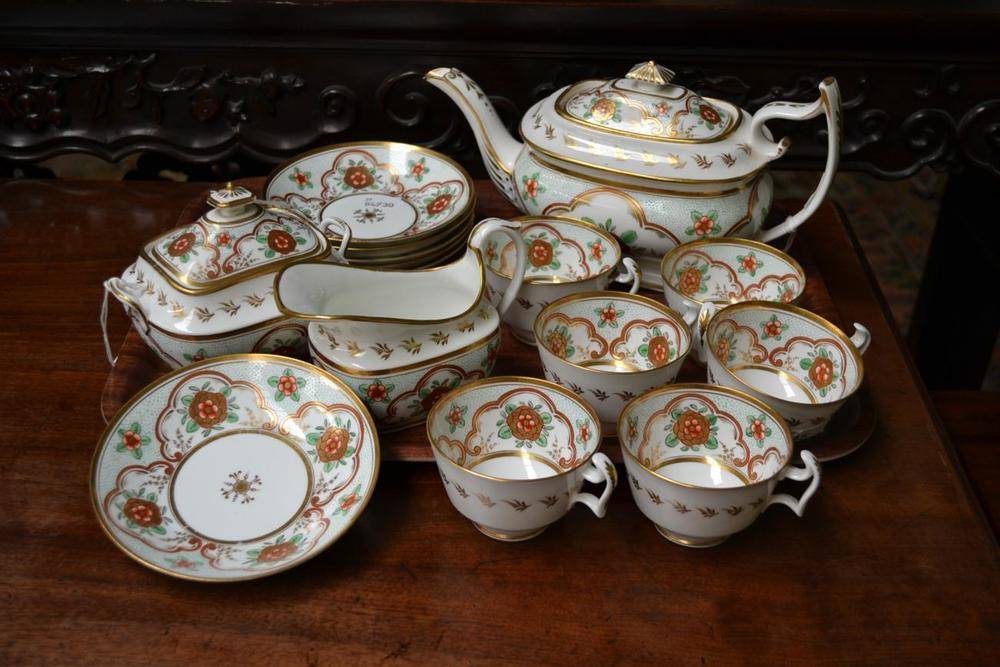 Lot 45 - A Swansea Porcelain Tea Service, circa 1820, painted in green, red and gilt with flower sprays...