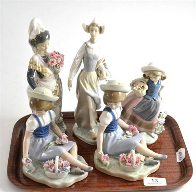 Lot 13 - Five Lladro figures comprising a girl with basket of flowers (x2), girl with bouquet of...