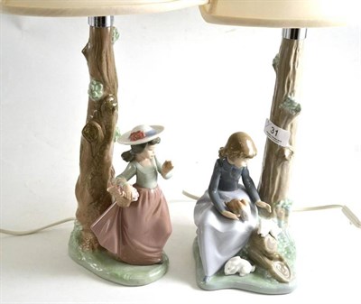 Lot 31 - A pair of Nao figural table lamps