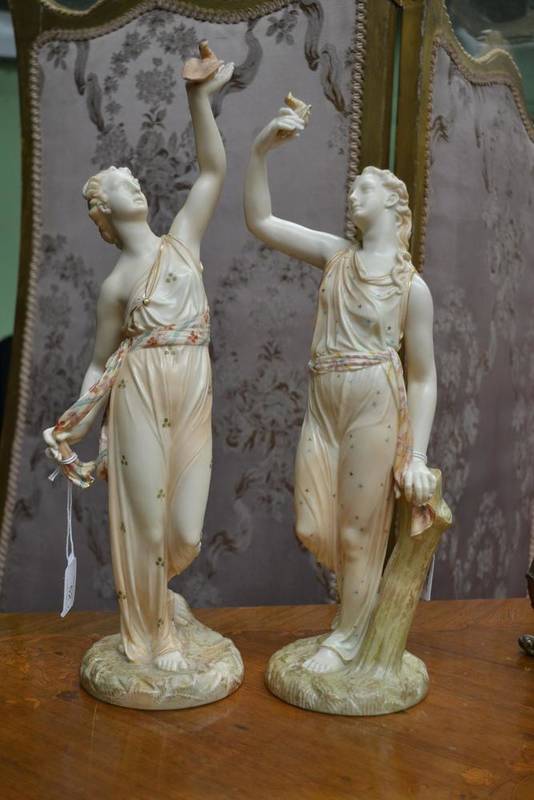 Lot 52 - A Pair of Royal Worcester Porcelain Figures, 1893 and 1894, as classical maidens holding birds...