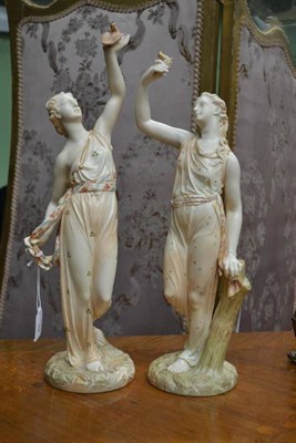 Lot 52 - A Pair of Royal Worcester Porcelain Figures, 1893 and 1894, as classical maidens holding birds...