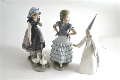 Lot 54 - Three Lladro figures comprising a fairy godmother, a young girl with two ducks and a dancer