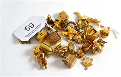 Lot 59 - Assorted charms, including a boat stamped '750', a roulette wheel and a Statue of Liberty with...