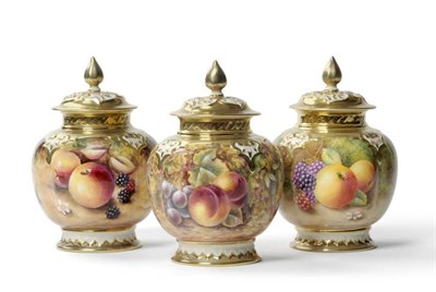 Lot 57 - A Set of Three Royal Worcester Porcelain Ovoid Vases and Covers, painted by T Nutt, D Buckle...