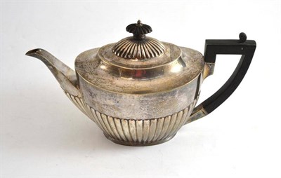 Lot 108 - A silver teapot with fluted decoration