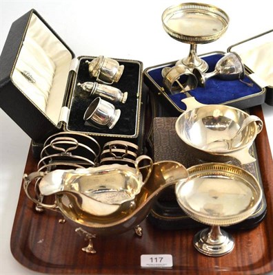 Lot 117 - A collection of silver comprising; a set of twelve teaspoons and tongs, six teaspoons and tongs...