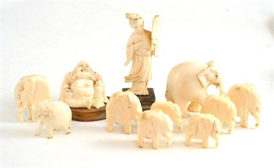 Lot 131 - An ivory Hotei, an ivory lady and nine ivory elephants (all pre 1947)