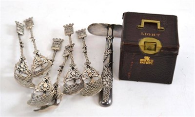 Lot 141 - A Continental baby push; a Berry's patent leather cased vesta case; and six white metal teaspoons