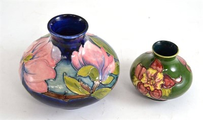 Lot 175 - A Walter Moorcroft Magnolia pattern vase and a Walter Moorcroft Columbine pattern vase (2)