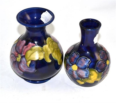 Lot 179 - Two Walter Moorcroft clematis pattern vases