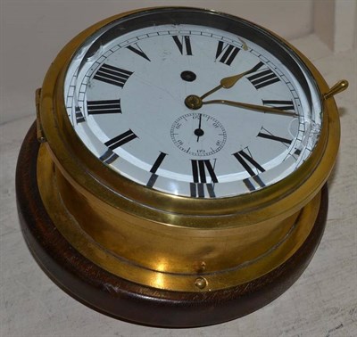 Lot 202 - A ship's brass bulk head clock