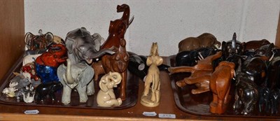 Lot 213 - A collection of elephants including ebony, pottery, etc (one shelf)