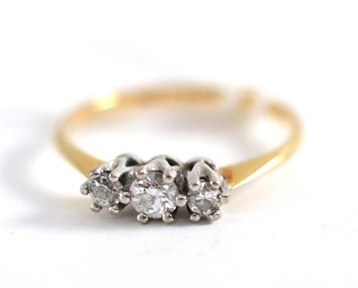 Lot 239 - A diamond three stone ring, total estimated diamond weight 0.25ct approx