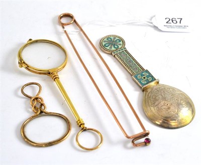 Lot 267 - An unmarked gilt metal and enamel caddy spoon, a gilt metal magnifier, a pair of yellow metal...
