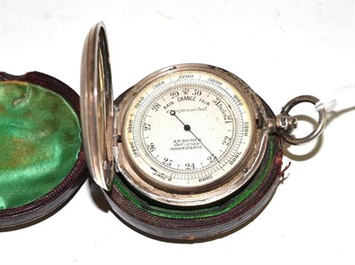 Lot 275 - A silver cased pocket barometer, retailed by A.R Baines, Optician Harrogate, with outer case