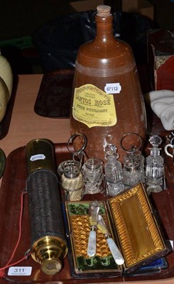 Lot 311 - Brass mounted telescope, stoneware wine jar, two cruet sets and two cased sets of flatware