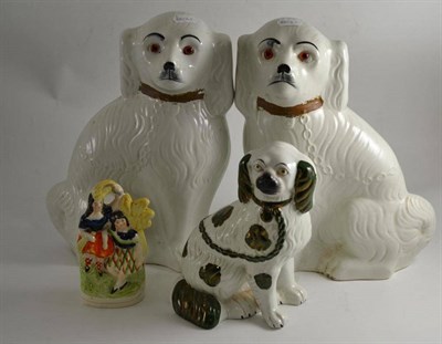 Lot 318 - Pair of Staffordshire dogs, a seated Staffordshire dog and a Staffordshire figure group