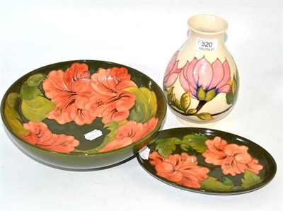 Lot 320 - Walter Moorcroft coral hibiscus bowl, on a green ground, impressed marks and painted monogram,...