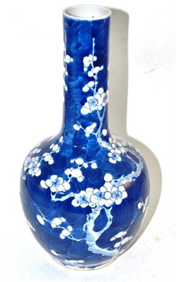 Lot 321 - A 19th century Chinese porcelain bottle vase decorated with flowering prunus blossom, bears...