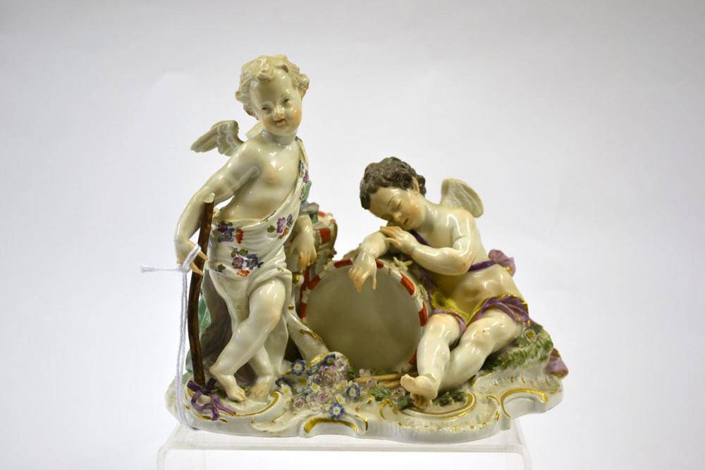 Lot 80 - A Meissen Porcelain Figure Group, circa 1760, as a putto holding a stick leaning on a drum, another