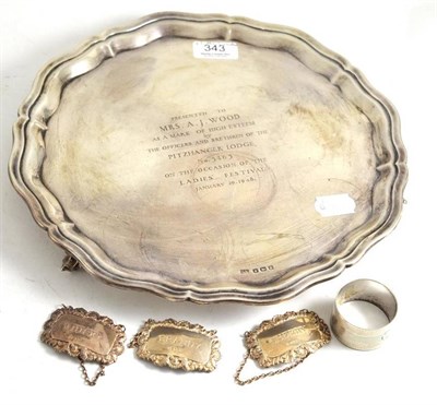 Lot 343 - A silver tray, napkin ring and three decanter labels