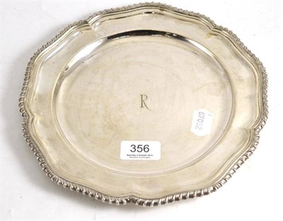 Lot 356 - A silver dinner plate, initialled R, gadrooned edge, London hallmark