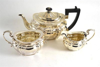 Lot 373 - A silver three piece tea service, London hallmark