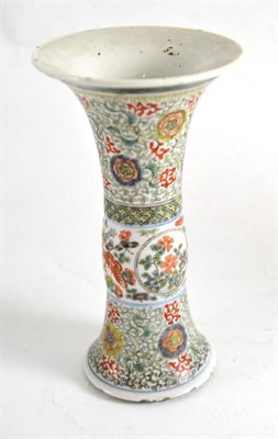 Lot 374 - A 19th century Chinese porcelain trumpet vase decorated in famille verte enamels with flowers...