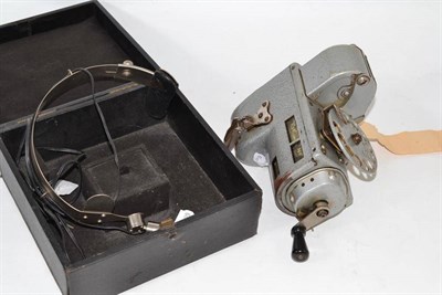 Lot 383 - A ticket machine and cased pair of radio headphones