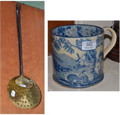 Lot 392 - A large pearlware mug and two brass and iron strainers