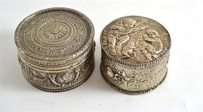 Lot 416 - A Continental silver circular trinket box and cover with Neo-Classical style decoration; and...