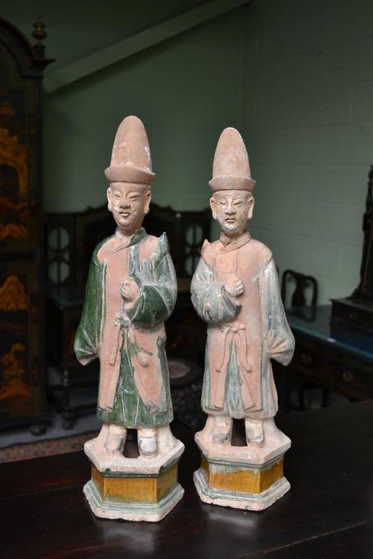 Lot 92 - A Pair of Chinese Part Glazed Terracotta Attendants, Ming Dynasty, the loose heads with tall...