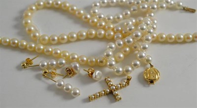 Lot 448 - Two cultured pearl necklaces, a cultured pearl cross pendant and two pairs of earrings