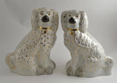 Lot 456 - Pair of Staffordshire spaniels - gilded