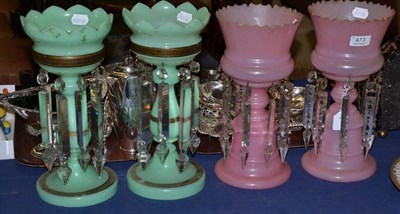 Lot 473 - A pair on Victorian pink glass table lustres with drops; and another pair in green with gilt...