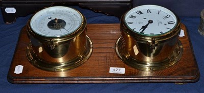 Lot 477 - A modern brass mounted ships wall clock and barometer, on a modern plinth