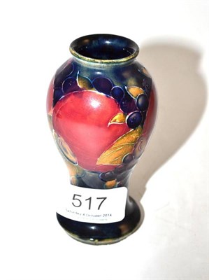 Lot 517 - A William Moorcroft pomegranate vase, impressed factory marks and green painted signature, 10cm