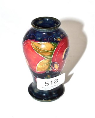 Lot 518 - A William Moorcroft pomegranate vase, impressed factory marks M45 and green painted monogram, 10cm