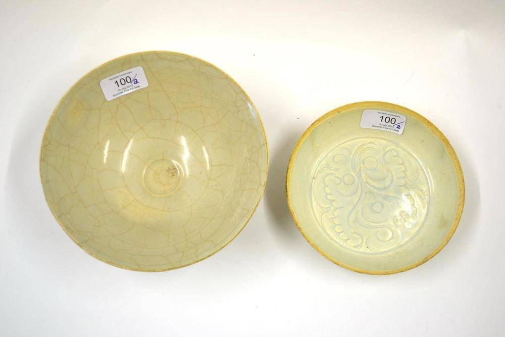 Lot 100 - A Chinese Qingbai Circular Dish, probably Song Dynasty, incised with scrolling foliage, 15cm...