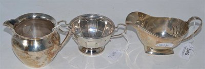 Lot 548 - Silverware comprising jug, London hallmark, sauce boat, Birmingham hallmark and Christening...