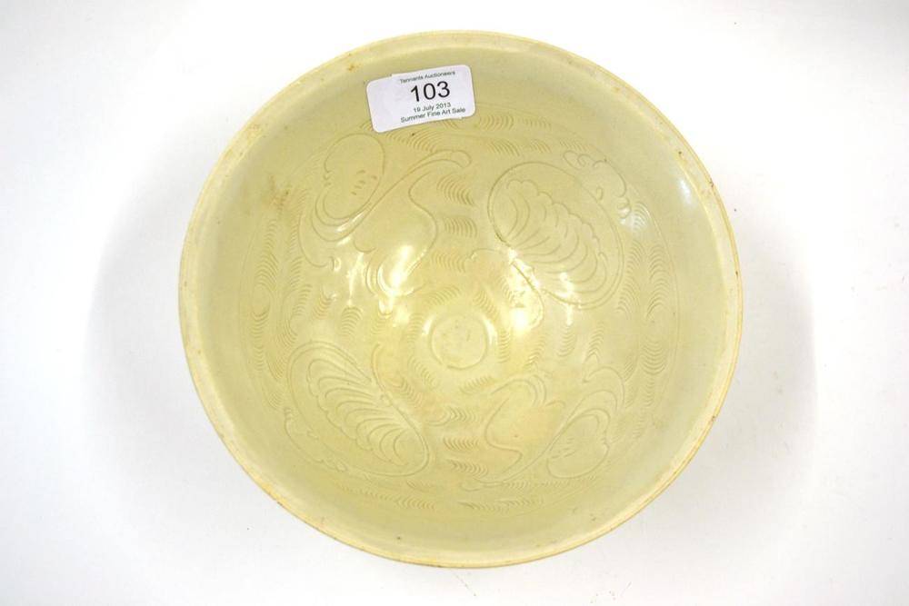 Lot 103 - A Ding Type White Glazed Pottery Bowl, probably Song Dynasty, incised with boys and scrolls,...