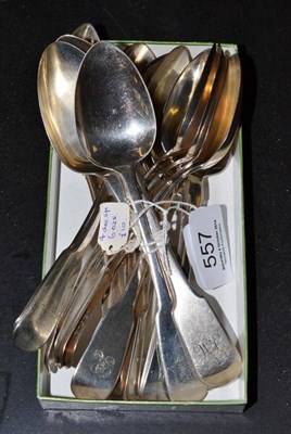 Lot 557 - Sixteen assorted 19th century silver fiddle pattern dessert spoons, many crested