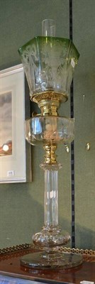 Lot 564 - A cut glass oil lamp, shade and chimney; together with three books on oil lamps