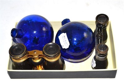 Lot 567 - A pair of ";Bristol"; blue glass target balls, 9.5cm high; a pair of tortoiseshell opera...