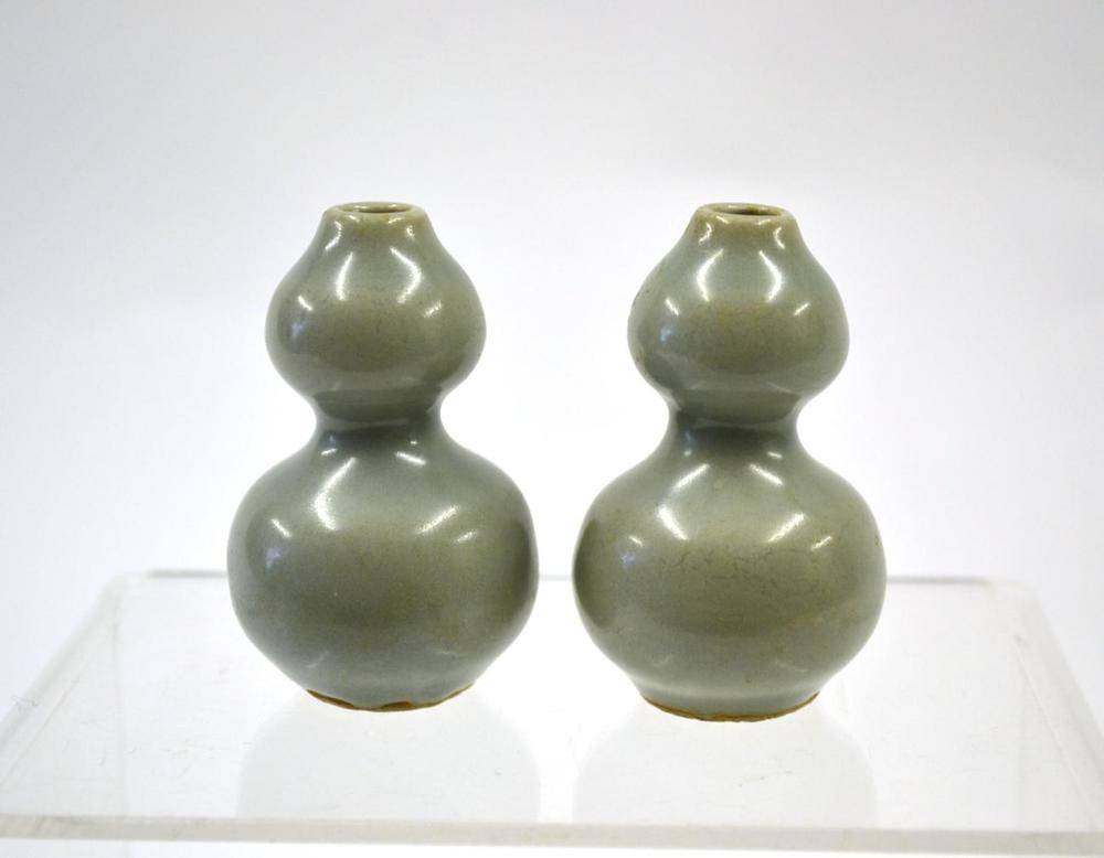 Lot 105 - A Pair of Longquan Celadon Glaze Double Gourd Vases, Song Dynasty, 7cm high  Provenance: Sotheby's