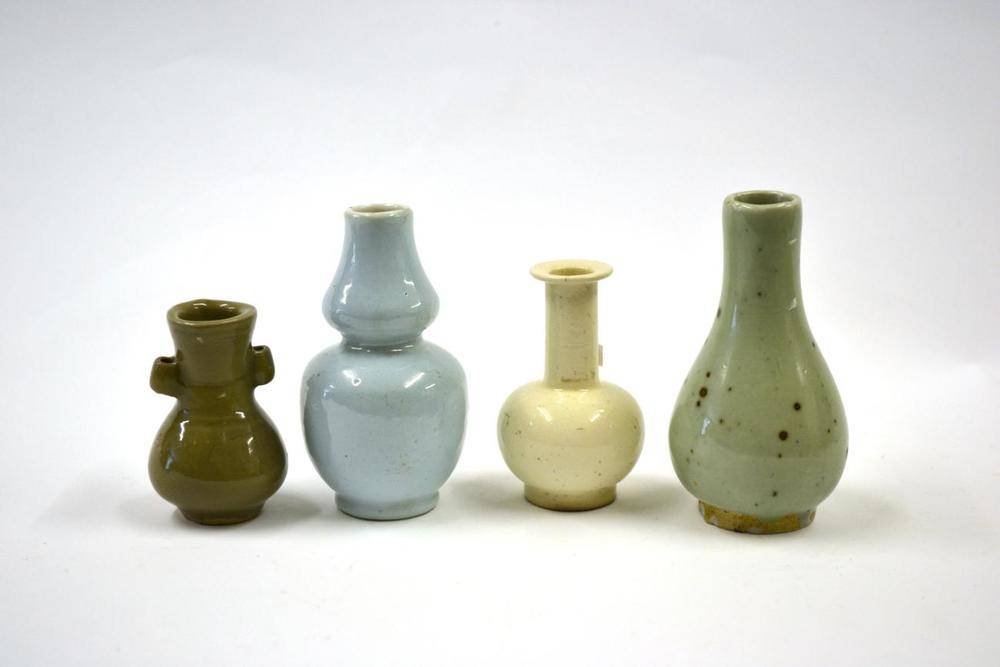 Lot 106 - A Chinese Celadon Glazed Bottle Vase, possibly Yuan Dynasty, with brown splashed decoration,...