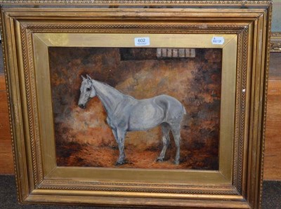 Lot 602 - ** Wright (19th/20th century) a grey horse in a stable, signed, oil on canvas