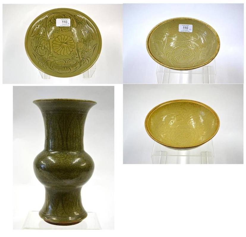 Lot 110 - A Chinese Celadon Glazed Bowl, in Longquan style, with incised foliate decoration, 18.5cm high;...